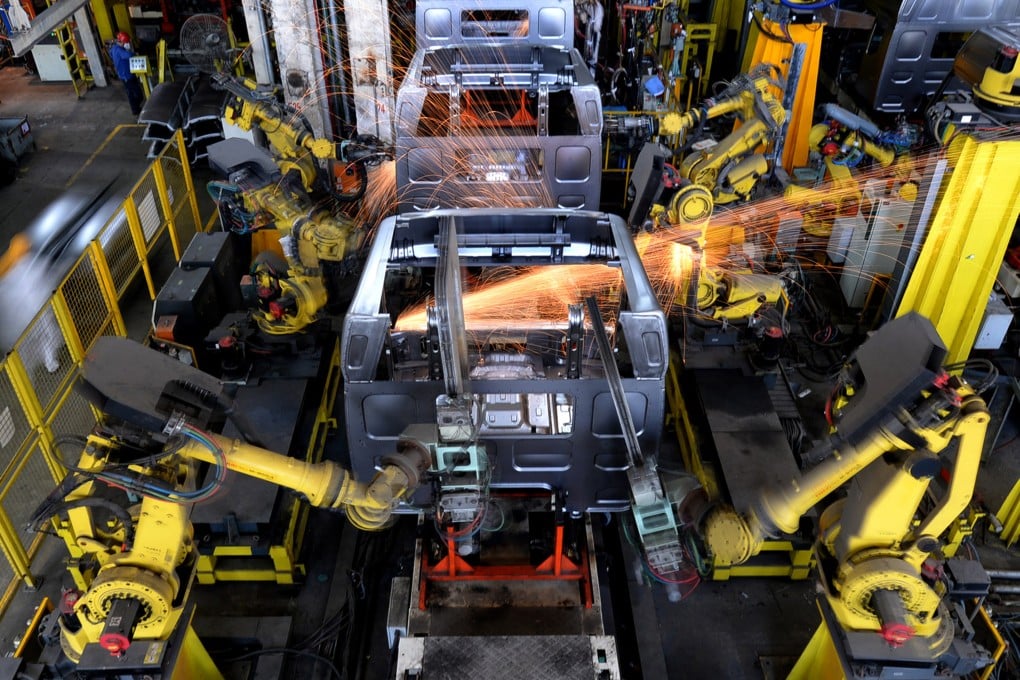 Industrial robots weld automobile bodies at a workshop of a motor vehicle manufacturing factory in Liuzhou city, southwest China's Guangxi Zhuang Autonomous Region. Photo: Imaginechina
