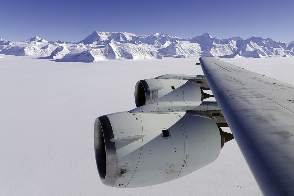 A Nasa flying laboratory surveys Antarctica's ice sheet. A new study says that burning all the world’s fossil fuel reserves could push up world sea levels by more than 50 metres over thousands of years. Photo: AFP