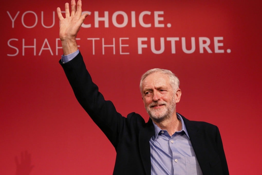 Corbyn waves after making his inaugural speech at the Queen Elizabeth Centre in central London. Photo: Reuters