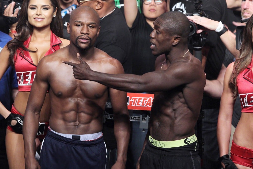 Floyd Mayweather Jnr and Andre Berto at the official weigh-in for Sunday morning's (HK time) fight. Photos: AFP