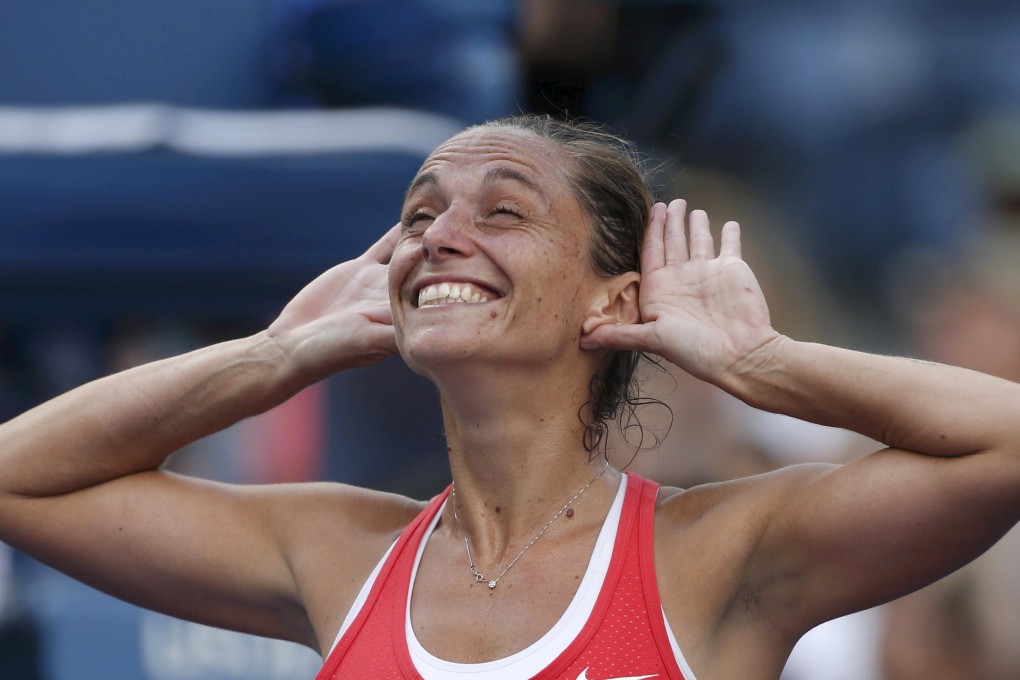 Roberta Vinci celebrates with the crowd after defeating Serena Williams. Photo: Reuters