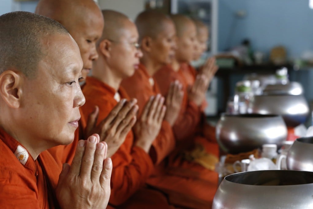Women Buddhist monks pray at the Songdhammakalyani Monastery in Nakhon Pathom. Thailand has some 100 bhikkhunis who were ordained in Sri Lanka, where women are allowed to become monks. Photo: AP