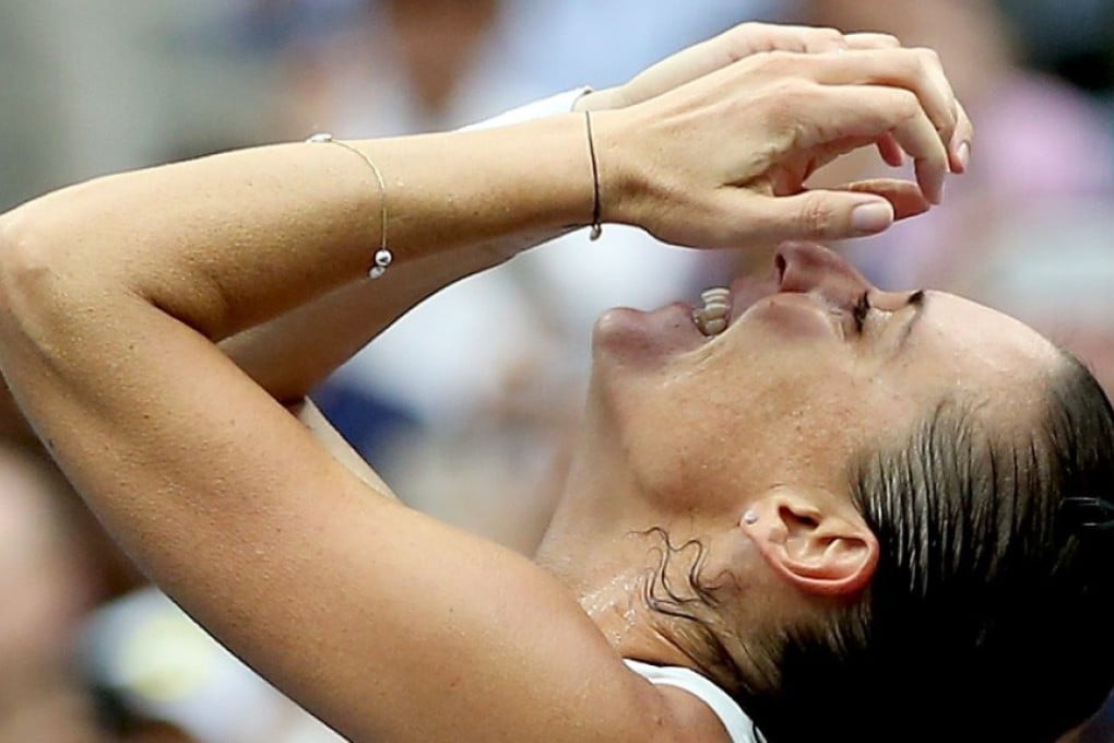 Flavia Pennetta of Italy cannot believe she has just won the US Open, beating good friend Roberta Vinci. Photo: AFP