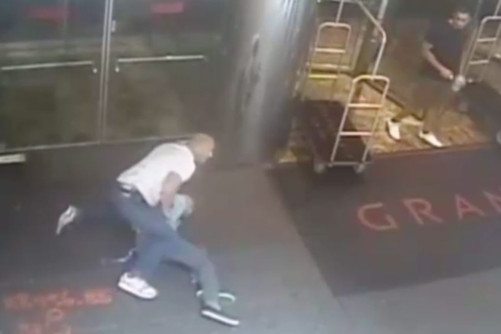 A frame grab from a surveillance video shows an undercover New York City police officer arresting former tennis pro James Blake in front of a hotel in New York. Blake was waiting to attend the US Open. Photo: EPA