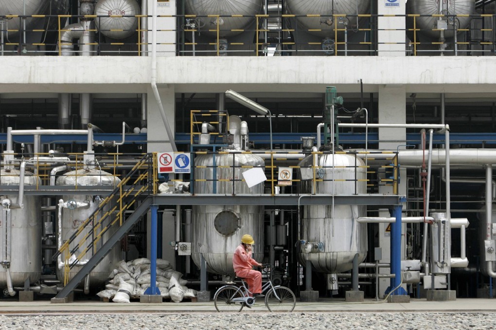 A worker cycles inside China National Petroleum Corporation  Lanzhou Chemical Industry Company in Lanzhou. The government says  changes in SOEs' capital structure would be pursued "gradually". Photo: Reuters