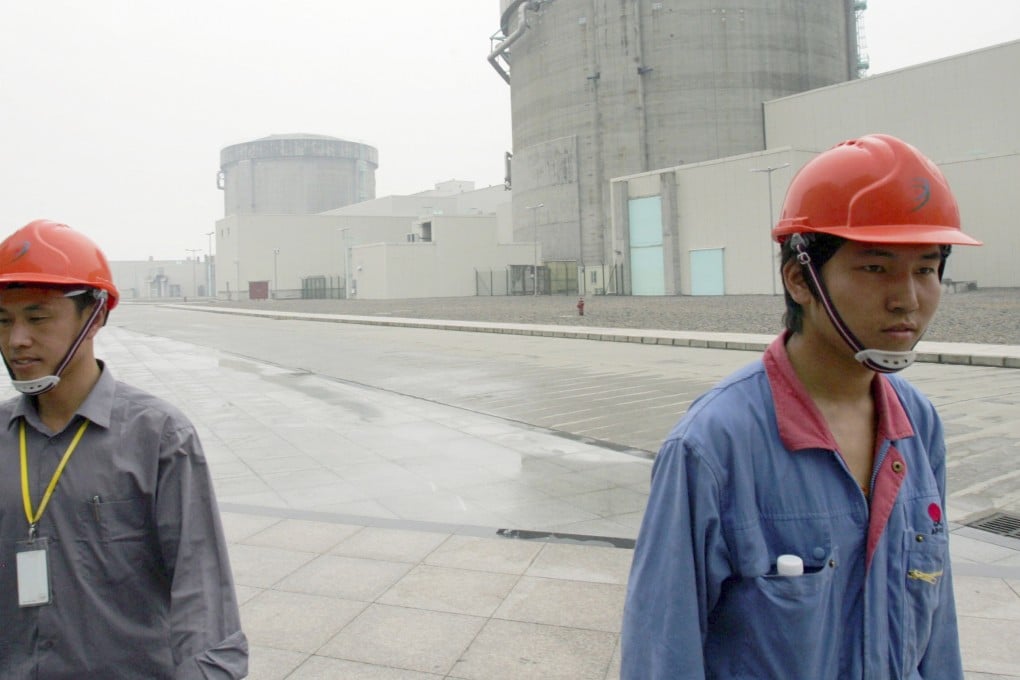 Chinese workers leave the nuclear power plant in Qinshan, in Zhejiang province, which will be inspected as part of nationwide safety checks. Photo Reuters