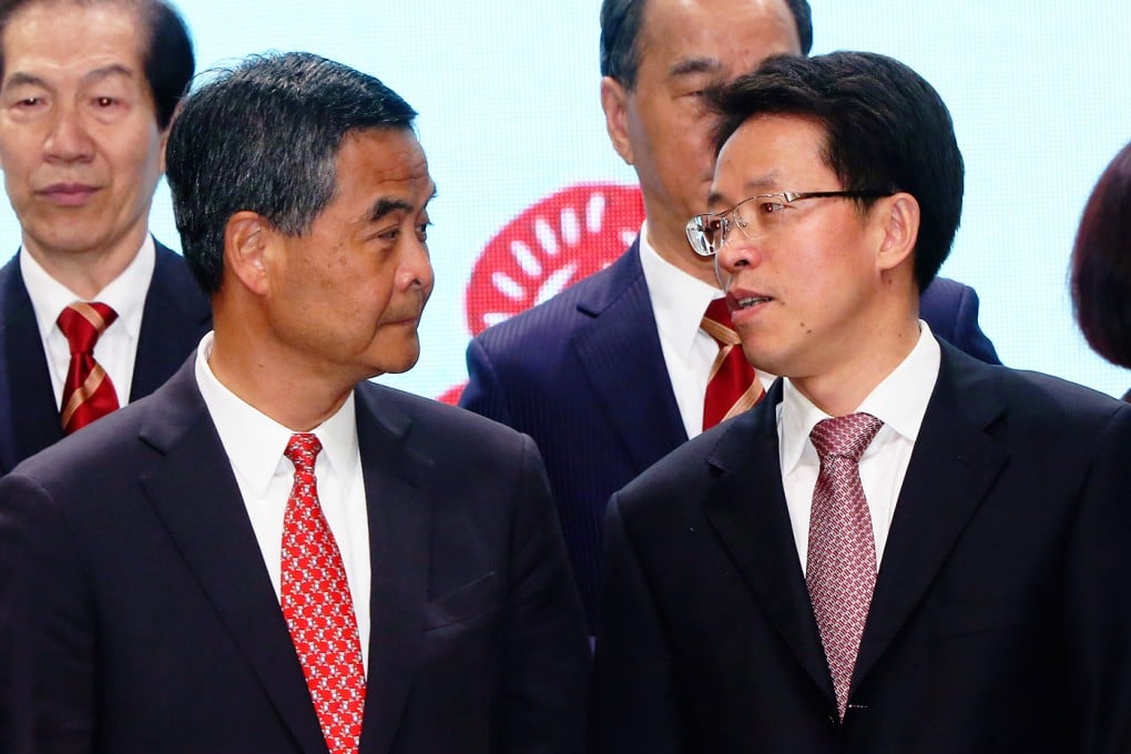 Chief Executive Leung Chun-ying (second left) and Director of the Central Government's Liaison Office in Hong Kong Zhang Xiaoming (third left). Photo: Felix Wong