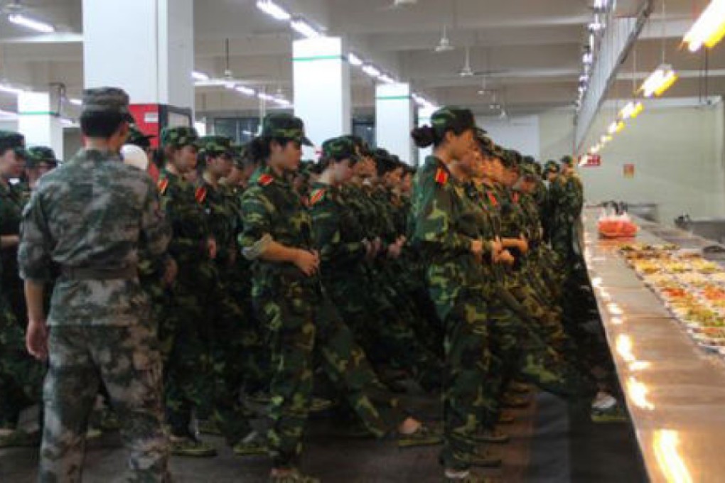 Hungry for knowledge: the students try to concentrate on their drill discipline in full view of their lunch. Photo: Thepaper