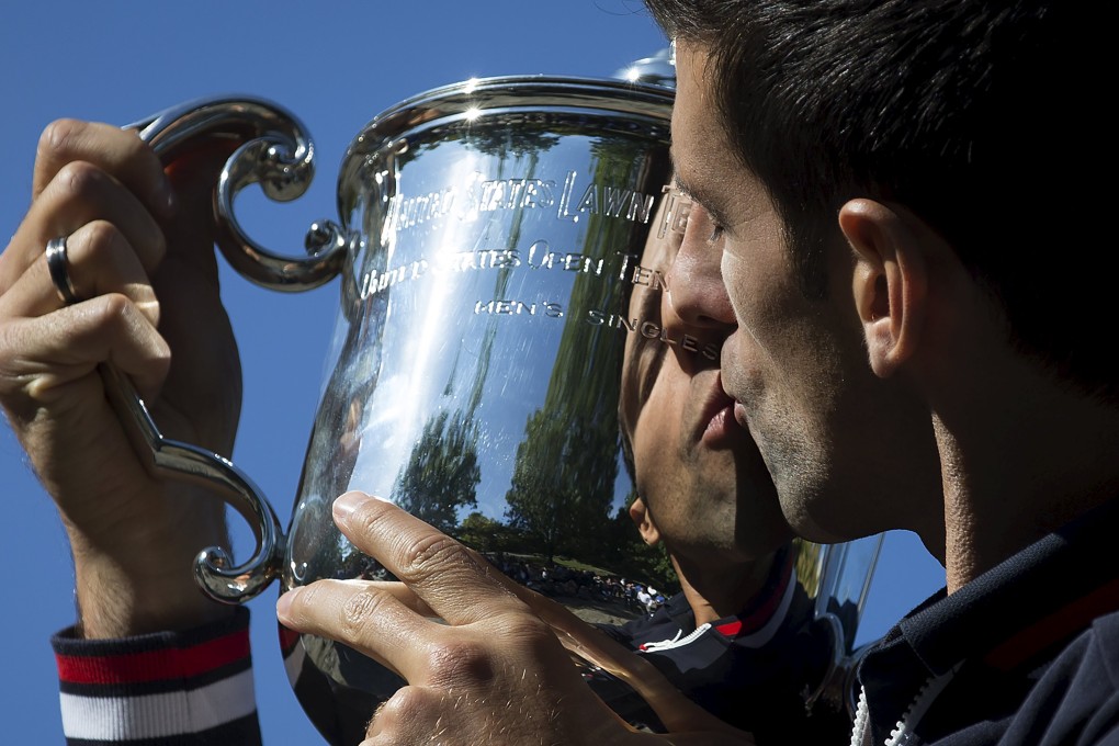 Novak Djokovic kisses the trophy. Photo: Reuters