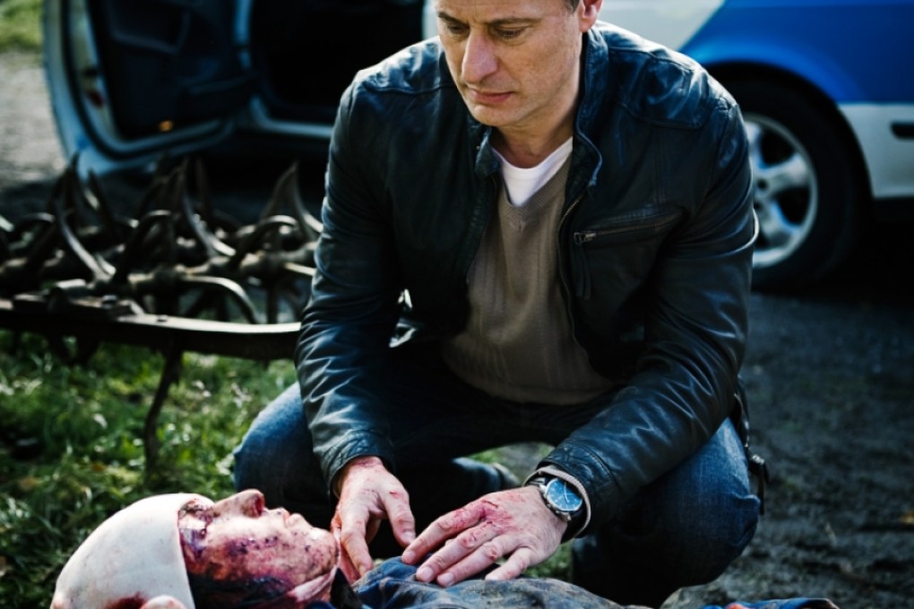 Michael Nyqvist with Noomi Rapace, playing a badly injured Lisbeth Salander, in a scene from The Girl Who Played With Fire