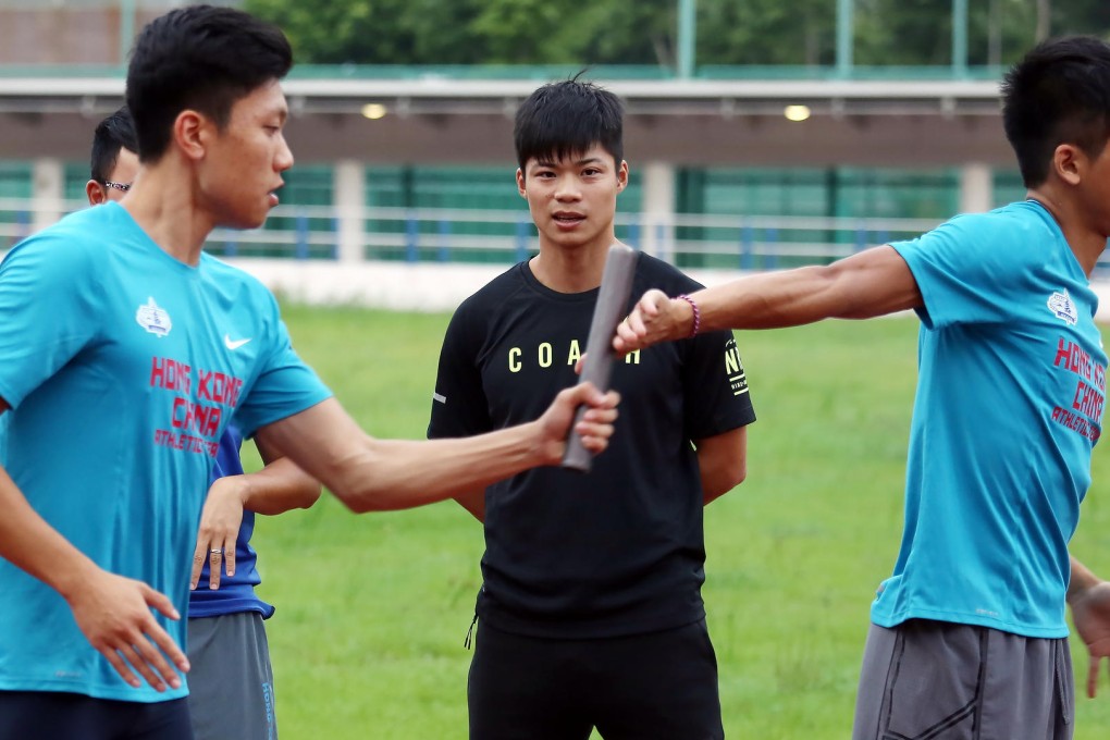 Sprinter Su Bingtian (centre) instructs Hong Kong sprinters on baton changes during a clinic at the HK Sports Institute. Photo: Jonathan Wong