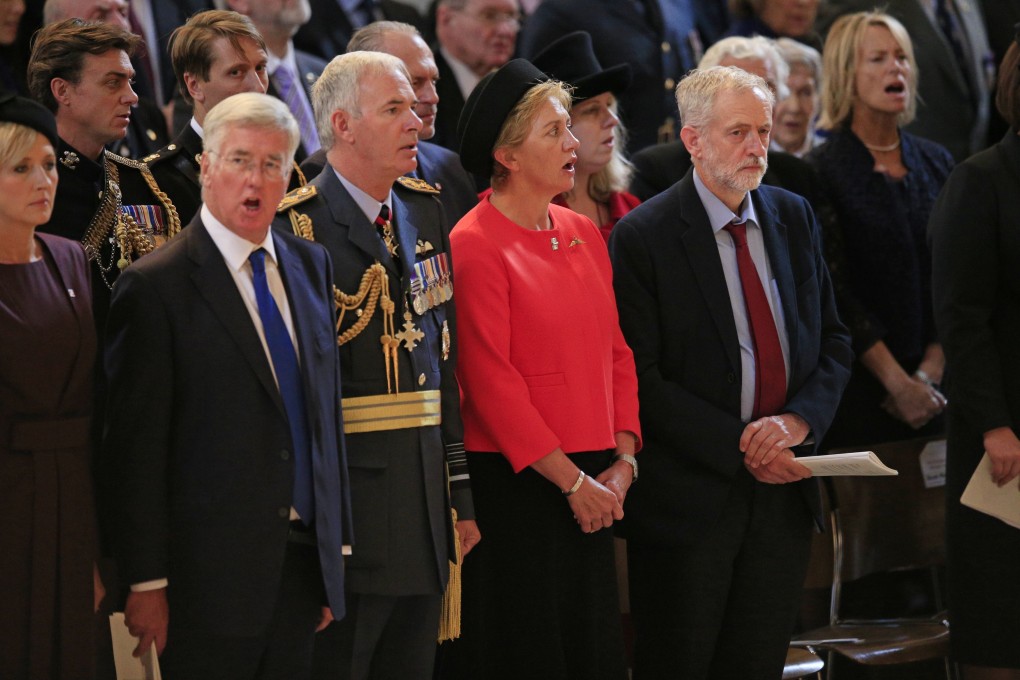 No singing: the leader of Britain's opposition Labour party Jeremy Corbyn, right, stands for the national anthem during the 75th anniversary Battle of Britain memorial service at St Paul's Cathedral in London.  Photo: AP