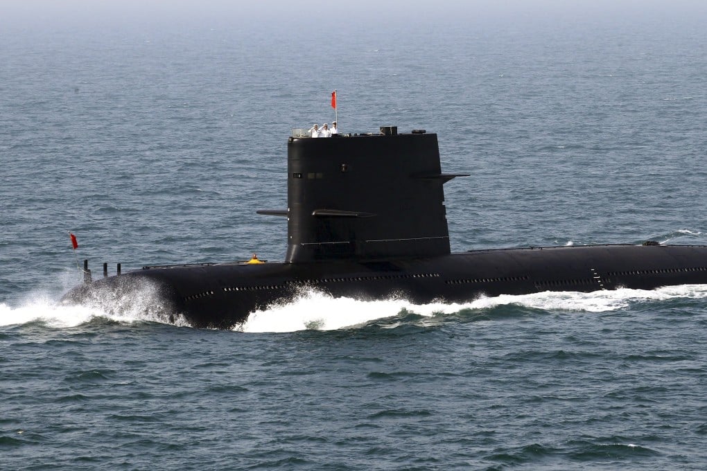 Chinese sailors salute on top of a submarine taking part in exercises in the Yellow Sea. Photo: Reuters