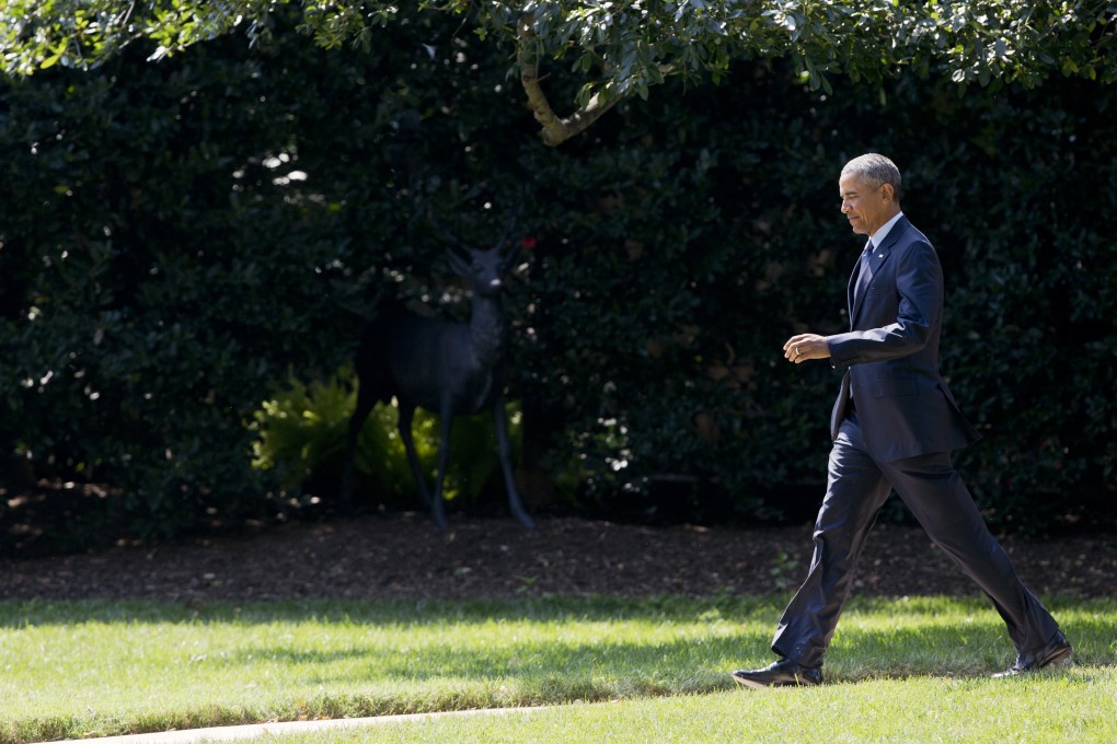 US President Barack Obama walks on the South Lawn from the Oval Office of the White House in Washington, where President Xi Jinping will be given a 21-gun salute. Photo: AP