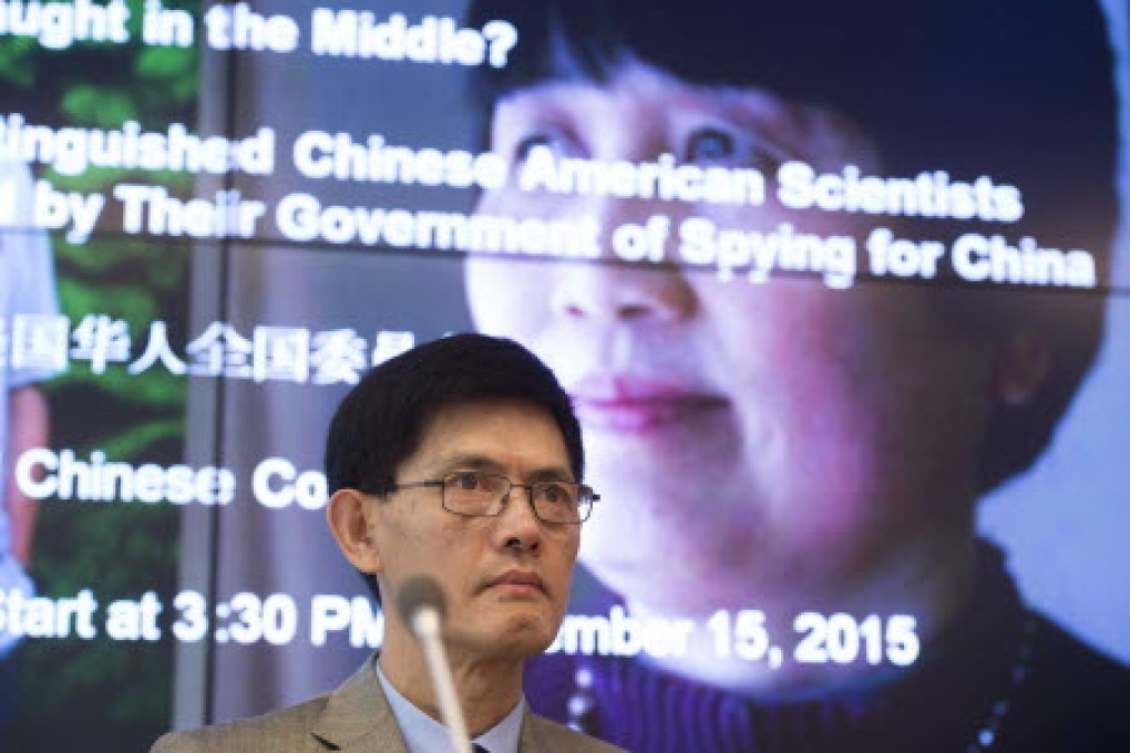 Xiaoxing Xi, chair of the Physics Department at Temple University, speaks alongside a photo of Sherry Chen right, a US federal government worker, about the dropped charges. Photo: AFP