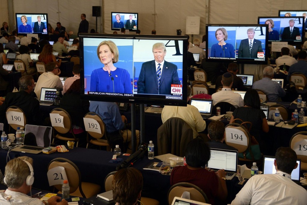 Media watch an exchange between US Republican presidential candidates Donald Trump and Carly Fiorina during the debate. Photo: EPA