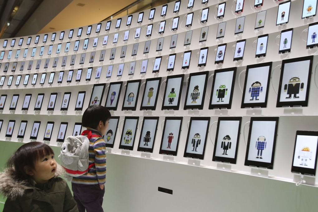 A display of phones and tablets running the Android operating system in a Tokyo mall. Photo: AP