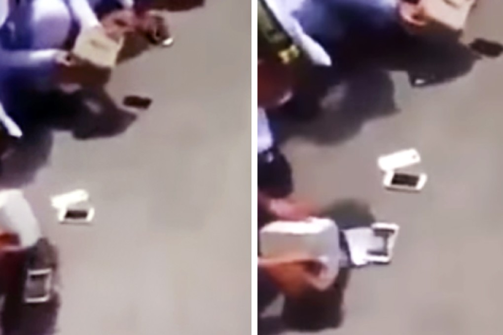 Thai military cadets smash their phones.