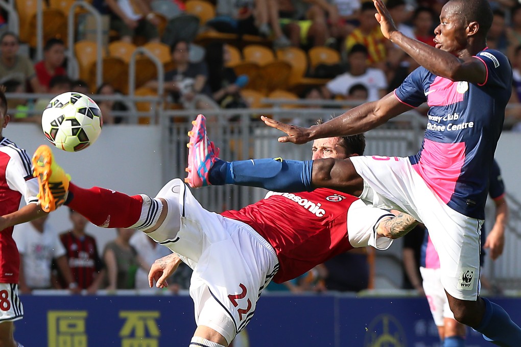 South China's Bojan Malisic (left) and Kitchee's Chris Kwesi in action during last year's Hong Kong Jockey Club Community Cup at Mong Kok Stadium. Photos: K.Y. Cheng