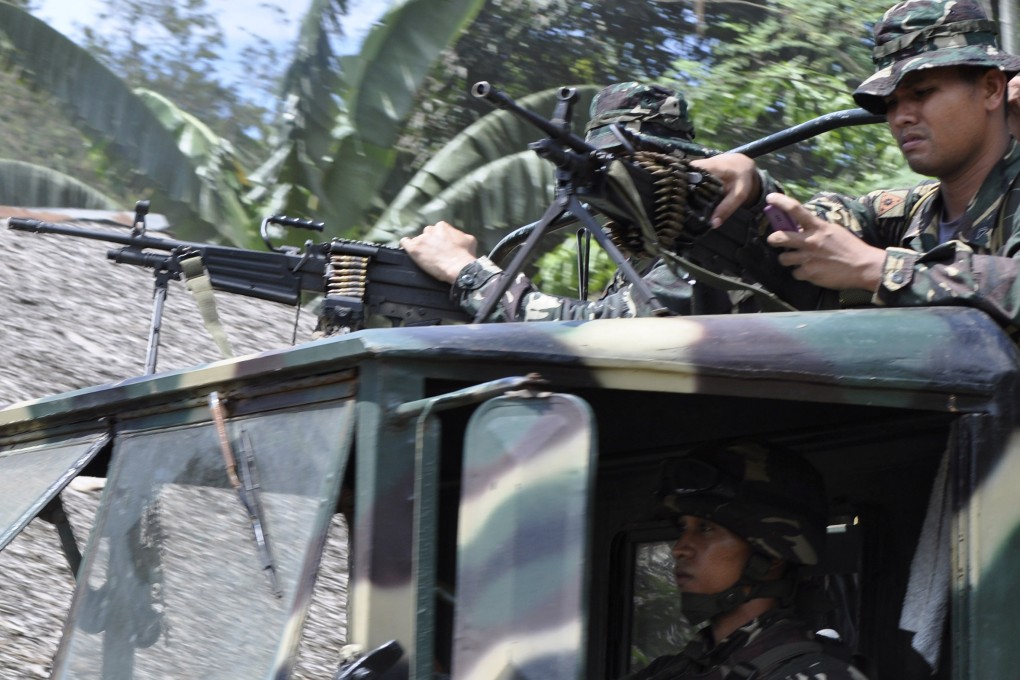 Philippine soldiers on patrol in the southern Philippines, where the Abu Sayyaf militant group is based. Photo: AP