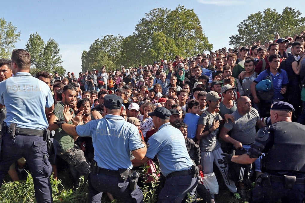 A special train transporting some 800 migrants from Tovarnik, near the Serbian border, arrived in Dugo Selo, near Zagreb, Croatia, yesterday morning. Photo: AFP