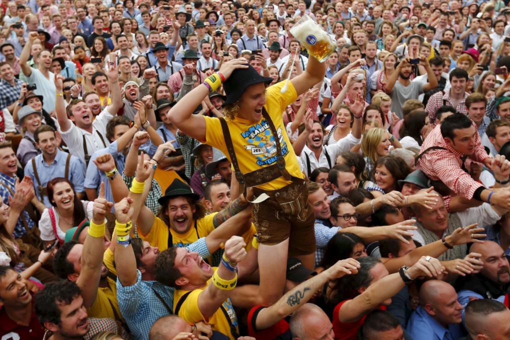 File photo of a visitor celebrating as he drinks one of the first mugs of beer during opening ceremony for a previous Oktoberfest in Munich. Photo: Reuters