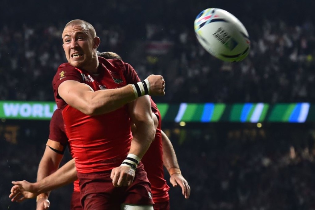 England fullback Mike Brown celebrates after scoring one of his two tries against Fiji in the opening match of the 2015 Rugby World Cup at Twickenham on Friday. Photo: AFP