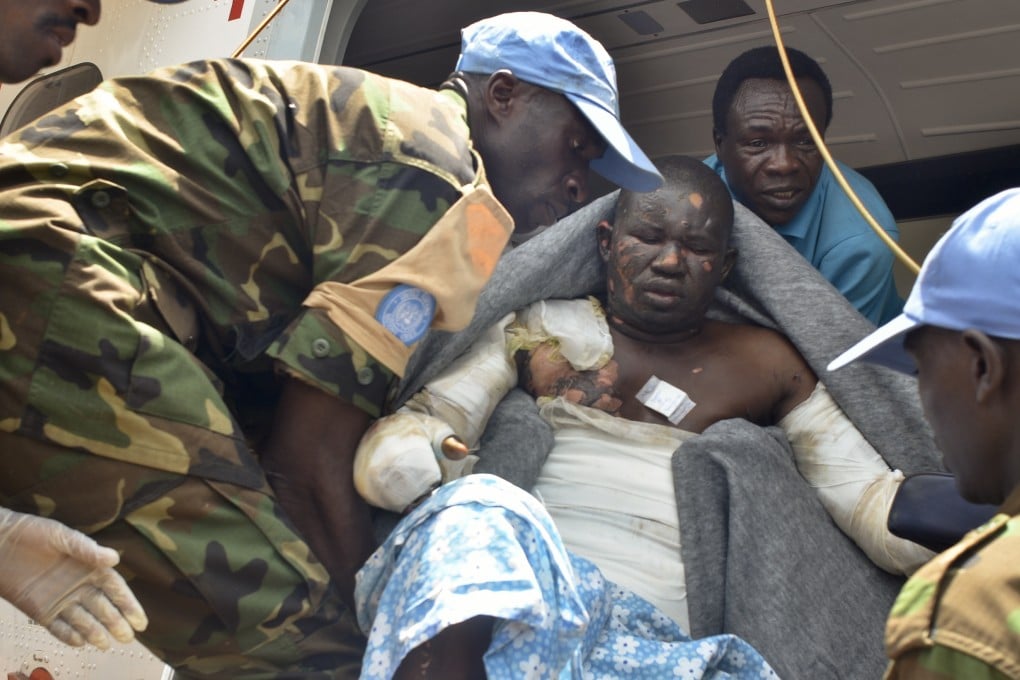 Rwandan UN peacekeepers evacuate a burn victim to the capital Juba by plane for medical treatment. Photo: AP
