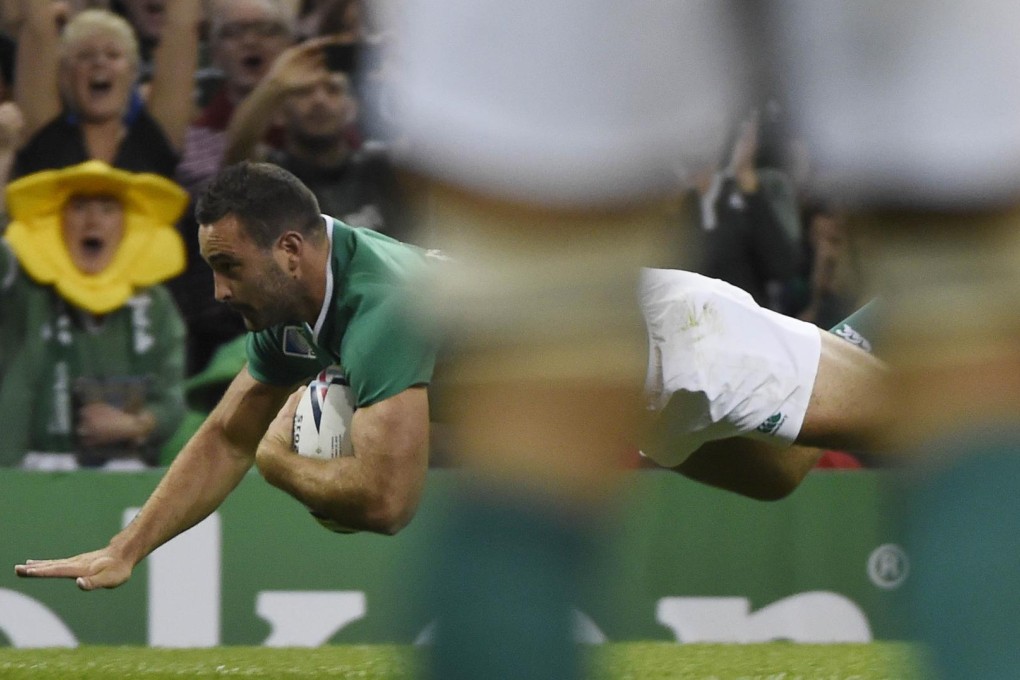 Ireland wing Dave Kearney scores a try in their demolition of Canada at Cardiff's Millennium Stadium. Photo: AFP
