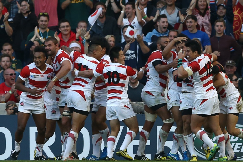 Japan players celebrate after full-back Ayumu Goromaru scores a try in their pool B match against two-time world champions South Africa in Brighton. Photo: AFP