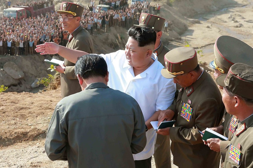 North Korean leader Kim Jong-Un (C) visiting Rason City. North Korea's readiness to fire a long-range rocket next month is seen as a pretext for testing ballistic missile technology banned under UN resolutions. Photo: AFP PHOTO/KCNA VIA KNS