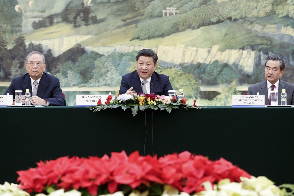 Chinese President Xi Jinping (centre), Director of China International Economic Exchange Centre Zeng Peiyan (left) and China's Foreign Minister Wang Yi meet US business leaders  at the Great Hall of the People in Beijing. Photo: AFP