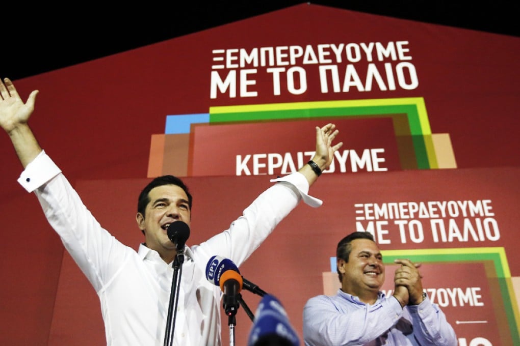 Syriza leader Alexis Tsipras (left) celebrates his party's victory in the Greek general elections. Photo: AFP