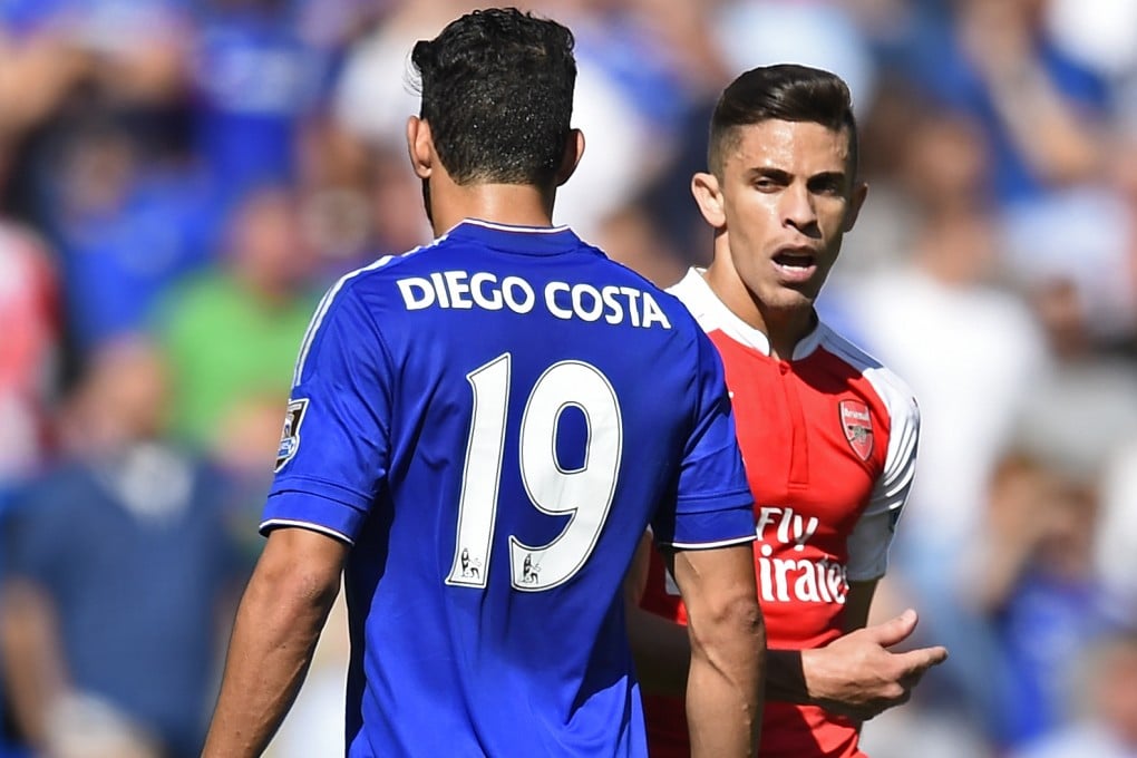 Arsenal's Gabriel Paulista walks past Chelsea's Diego Costa after clashing. Photo: Reuters