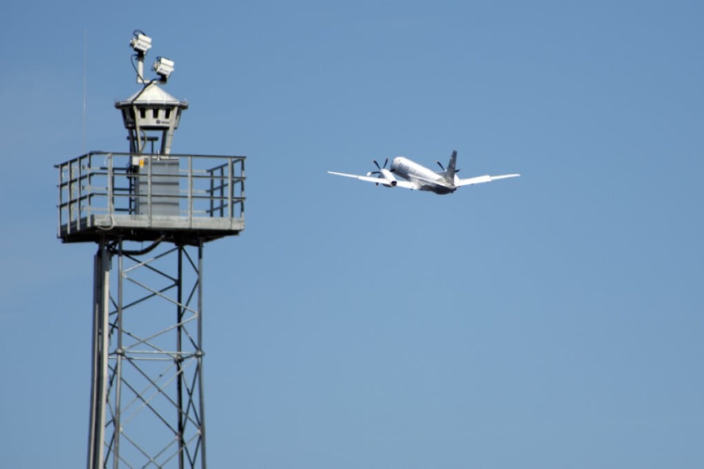A plane takes off beyond a remotely controlled control tower at Ornskoldsvik Airport in northern Sweden. Photo: Stefan Kalm