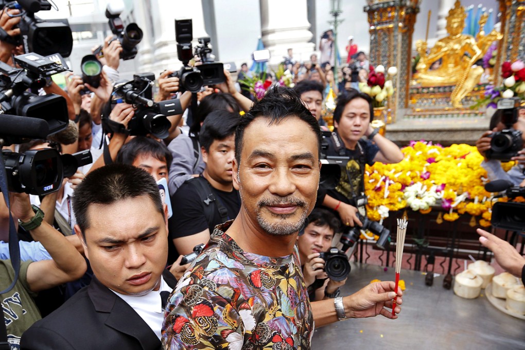 Hong Kong actor Simon Yam smiles during his visit to the Erawan shrine in central Bangkok, Thailand. Yam's visit is part of the Tourism Authority of Thailand's (TAT) campaign to restore tourist confidence. Photo: Reuters