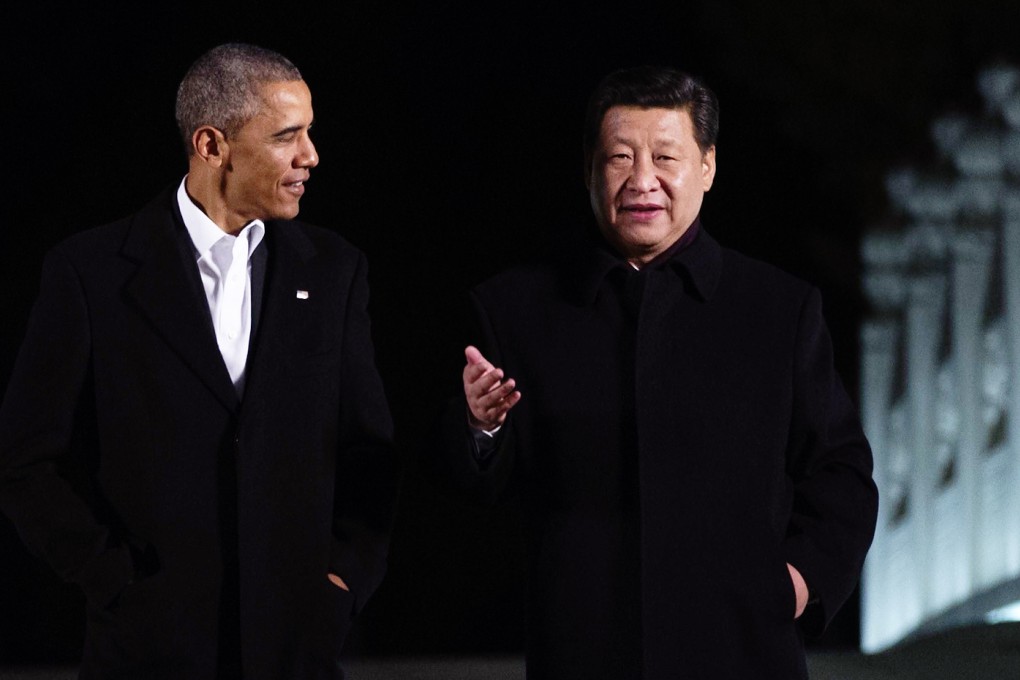 US President Barack Obama (left) walks with China's President Xi Jinping at the Zongnanhai leaders compound, ahead of a dinner in Beijing on November 11, 2014. Photo: AFP