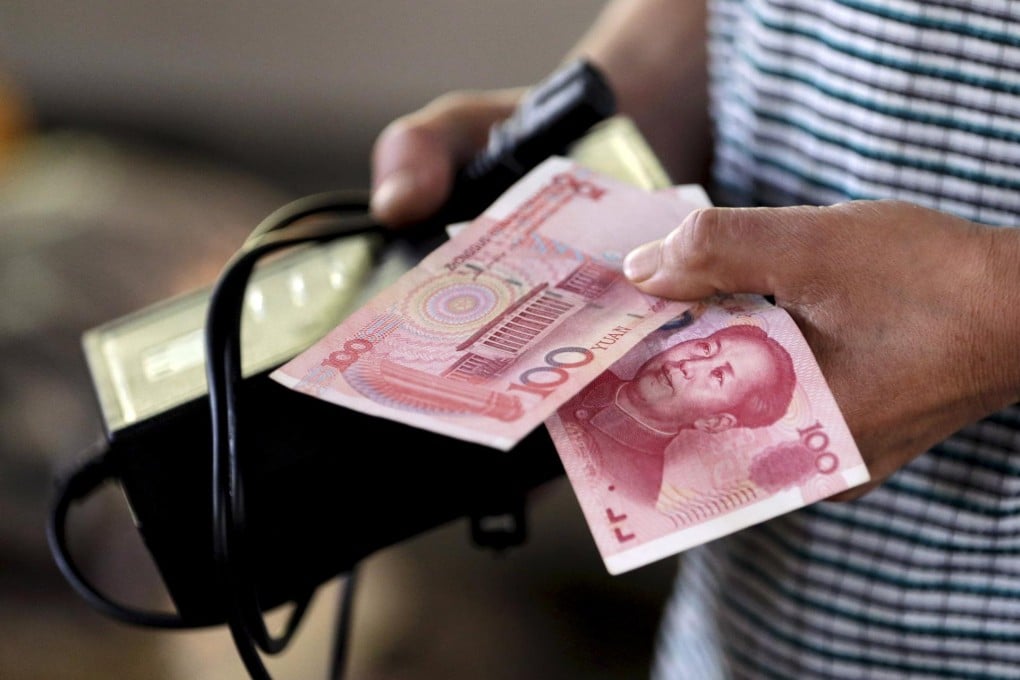 Banks signed 497.4 billion yuan of forward contracts for US dollars last month, triple the average in the first seven months. Photo: Reuters