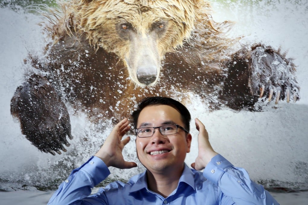 Dr Tin Man Lee in front of one of his bear photographs that is part of the exhibition.Photos: Dickson Lee