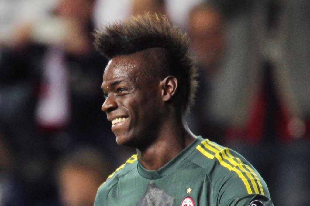 Mario Balotelli smiles after his goal. Photo: EPA