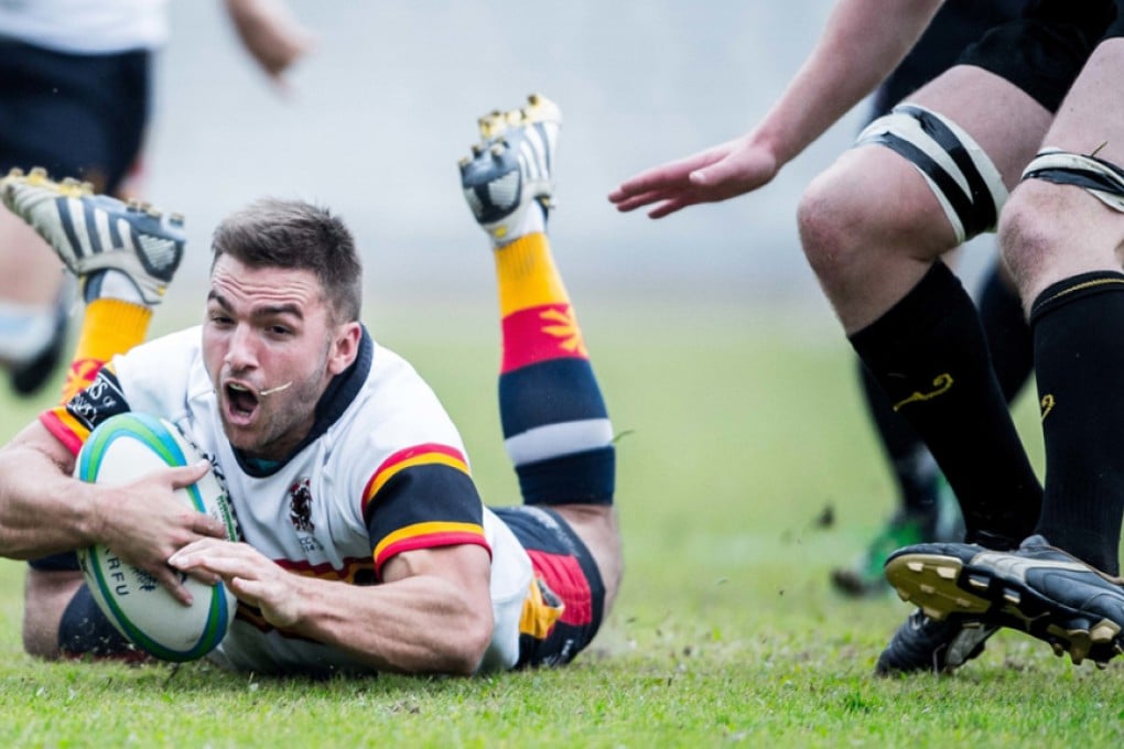 Leighton Asia HKCC's Liam Slatem dives over the line for a try. Photo: HKRU