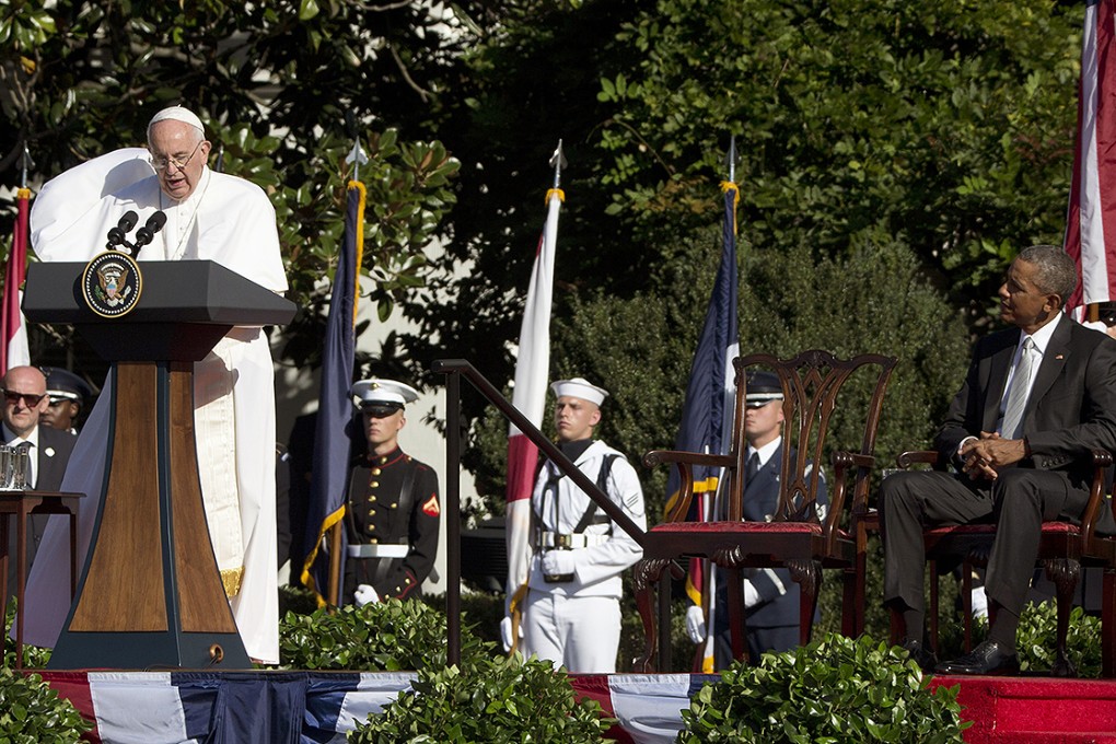 Pope Francis talks as President Barack Obama listens during a state arrival ceremony on the South Lawn of the White House in Washington. Photo: AP