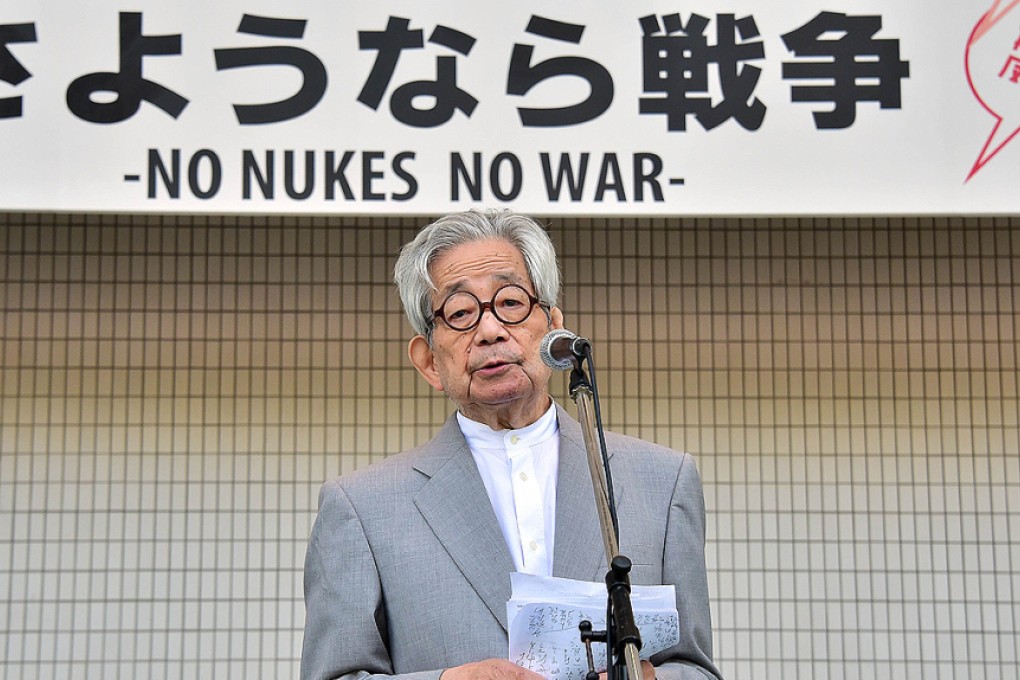 Nobel Literature Prize laureate Kenzaburo Oe speaks at a rally to protest against Japan's Prime Minister Shinzo Abe's controversial security bills and his nuclear policy in Tokyo yesterday. Photo: AFP