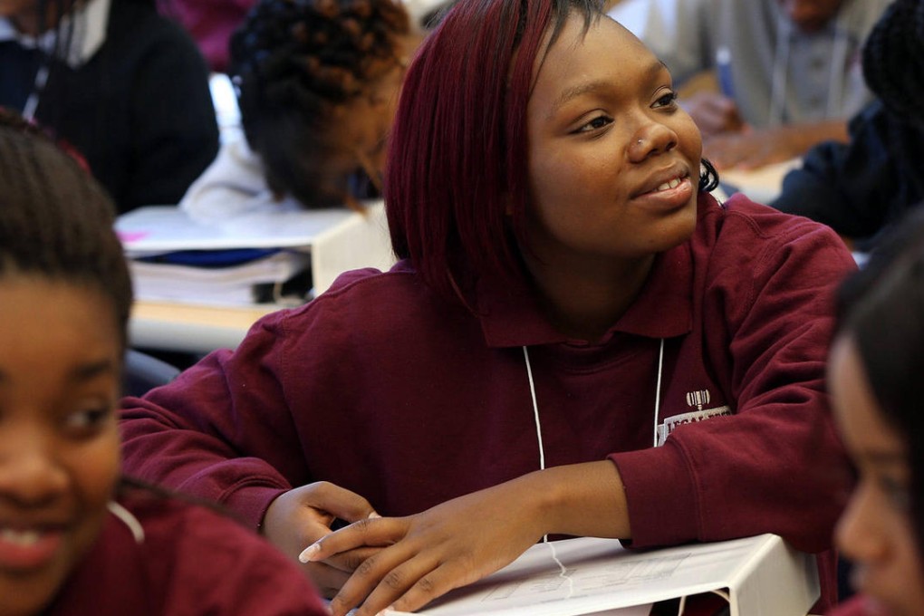 DeLexus Prater (centre) will part of Legal Prep's first graduating class. Photo: TNS