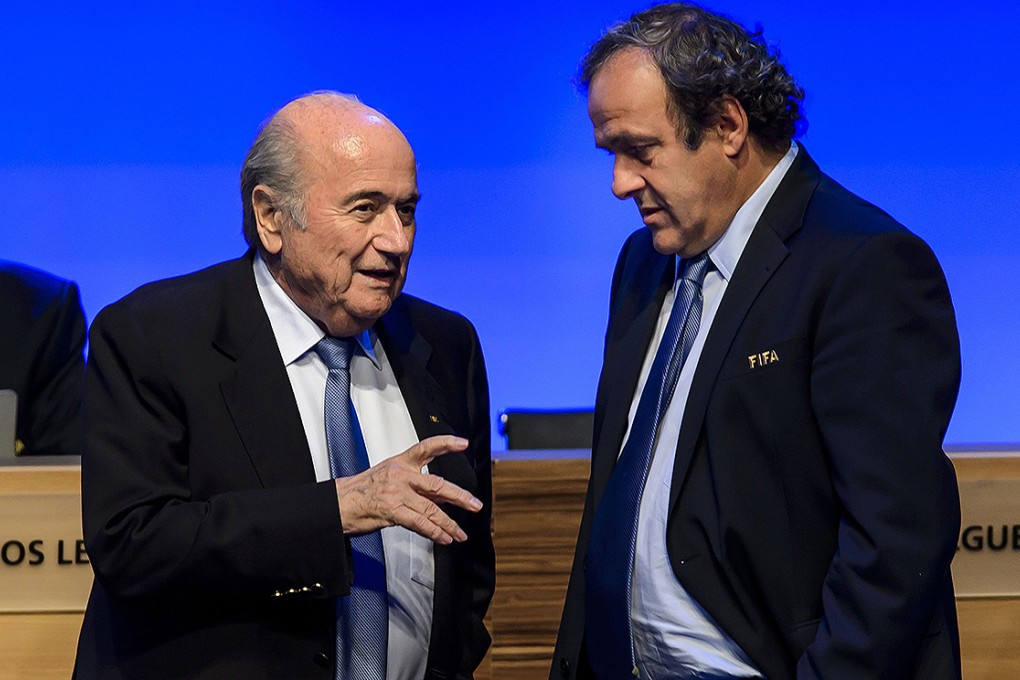 Fifa President Joseph Blatter talks to UEFA president Michel Platini during the 64th Fifa congress in Sao Paulo. Photo: AFP