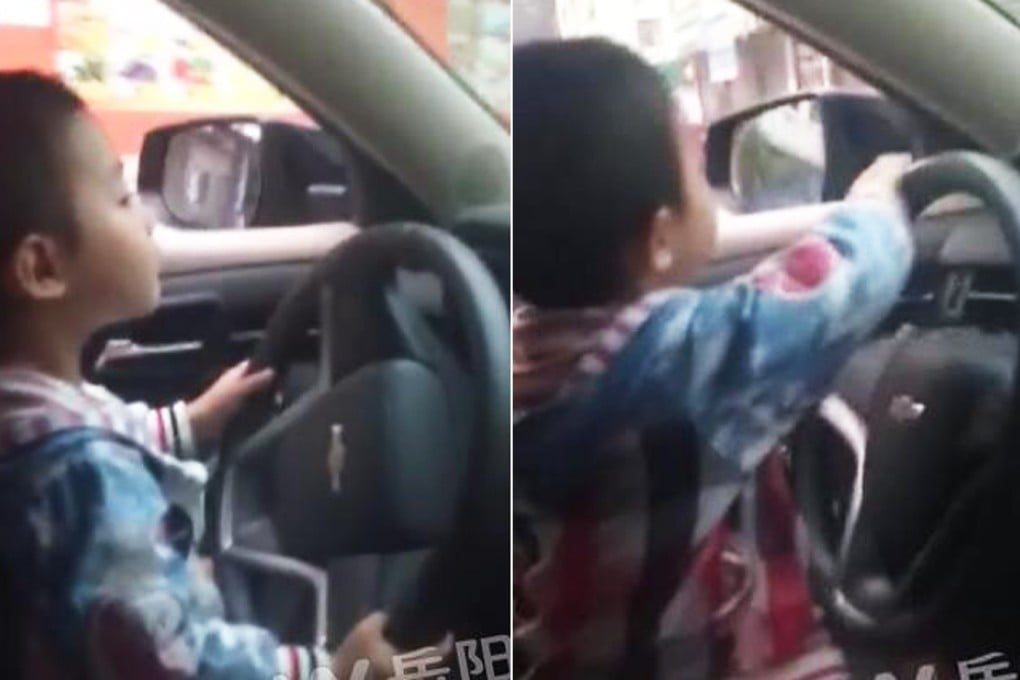 The boy, aged about four or five, was filmed driving on a busy highway in Hunan. Photo: Yueyang.com
