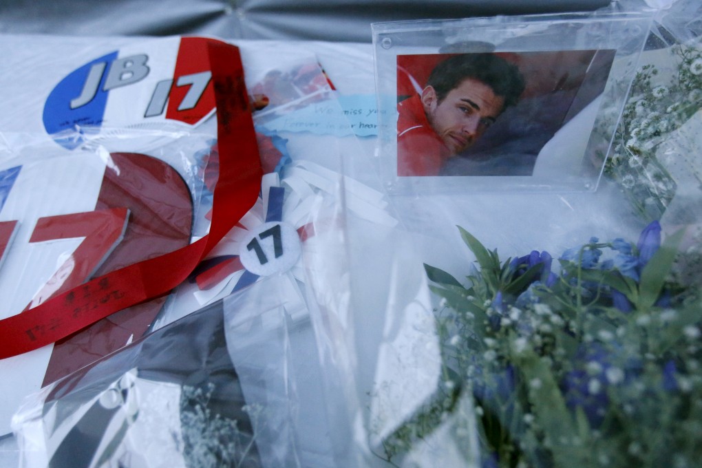 A photo of  Jules Bianchi  and flowers at a stand especially set up beside the track at the Suzuka circuit. Photo: Reuters