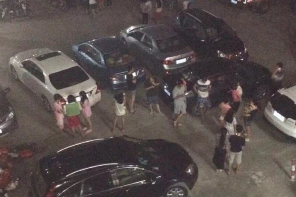 Some mainland residents at an unknown location run for cover.