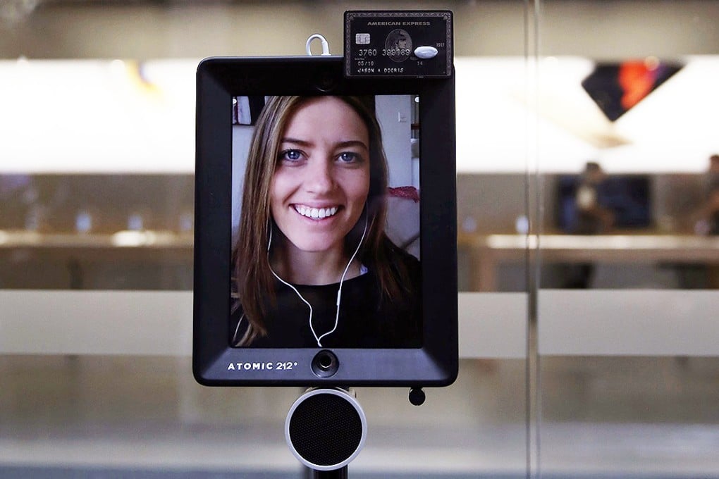 Lucy Kelly, appearing on Facetime, stands third in the line to purchase the new iPhone 6S, outside the Apple Store, in Sydney, Australia, on Friday. Photo: Reuters