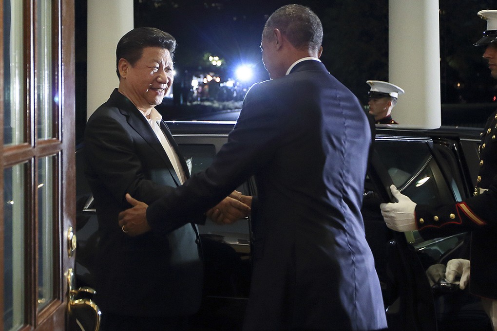 Chinese President Xi Jinping is greeted by US President Barack Obama as he arrives at the White House in Washington DC. Photo: Xinhua